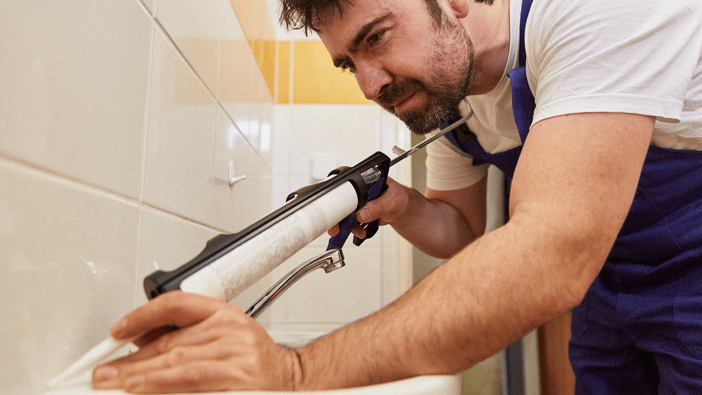 silicone vs caulk used around a bathroom sink to prevent water intrusion