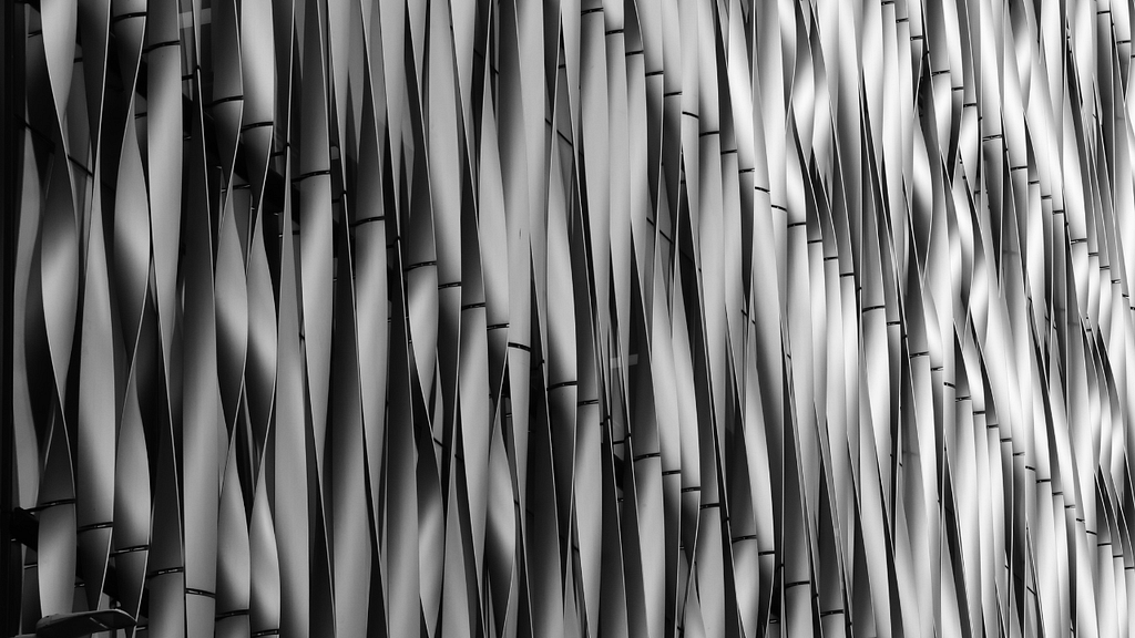 Abstract vertical pattern demonstrating rhythm, repetition, and visual balance through form and contrast.