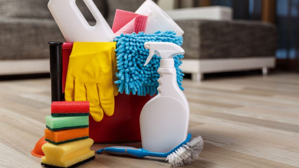 cleaning supplies including gloves, sponges and spray for deep cleaning a house before selling