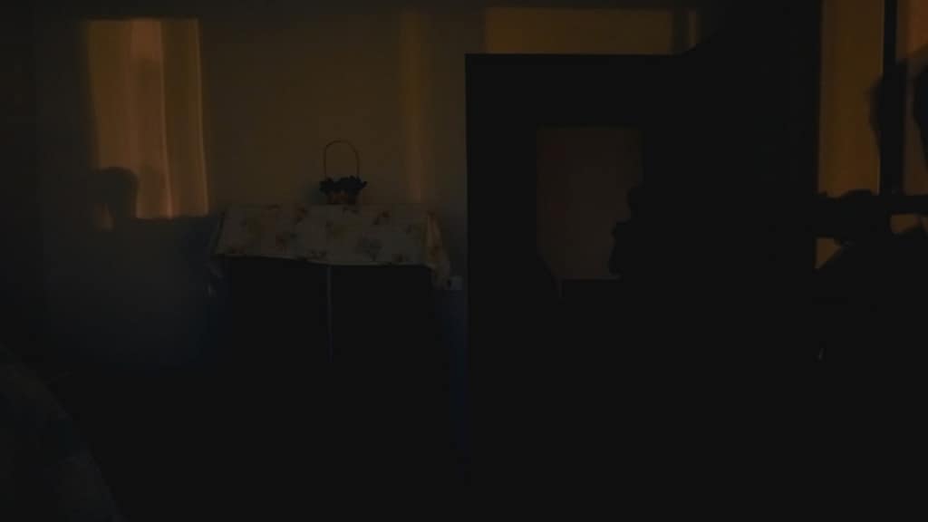 dark cluttered room showing poor home presentation for buyers