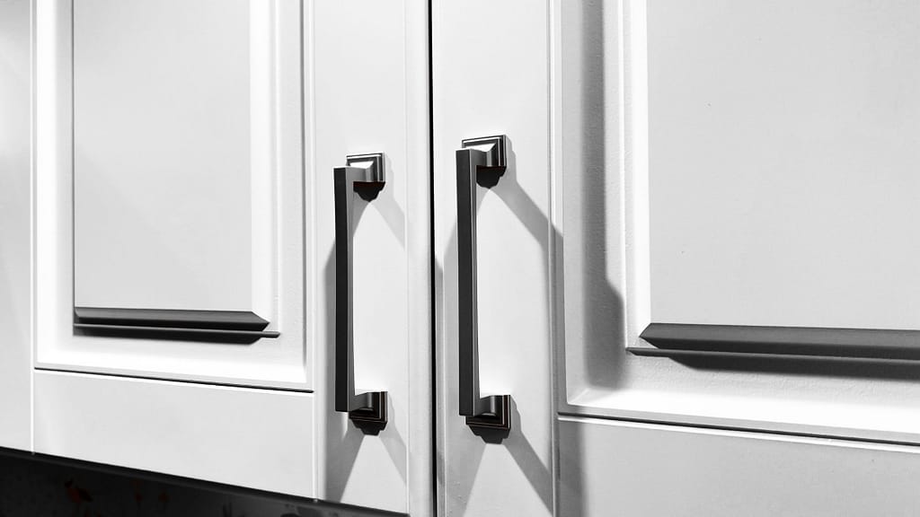 Close-up of modern black cabinet handles as a cheap kitchen upgrade idea