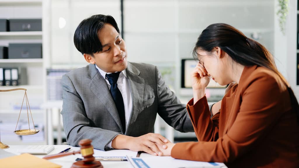 Home seller feeling stressed while meeting with a real estate agent during the selling process