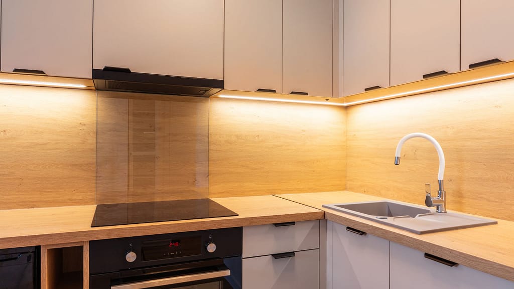 Warm under cabinet lighting in kitchen showing how to upgrade a kitchen on a budget