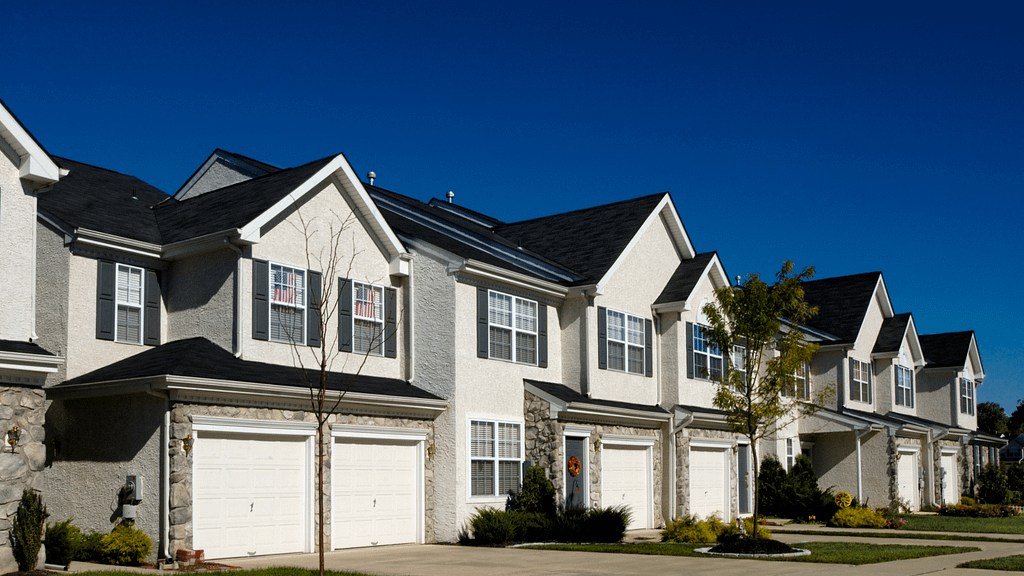 Row of attached homes in a residential community representing condo livin