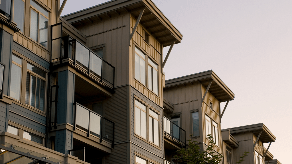 Modern condo building with balconies representing contemporary condo living