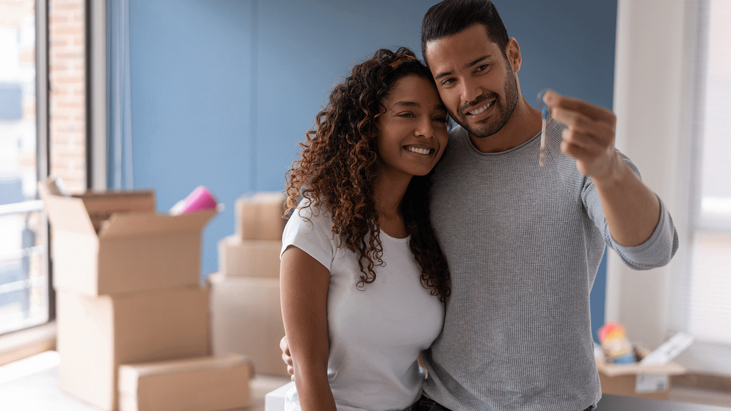 Young couple choosing the best time of the year to buy a house