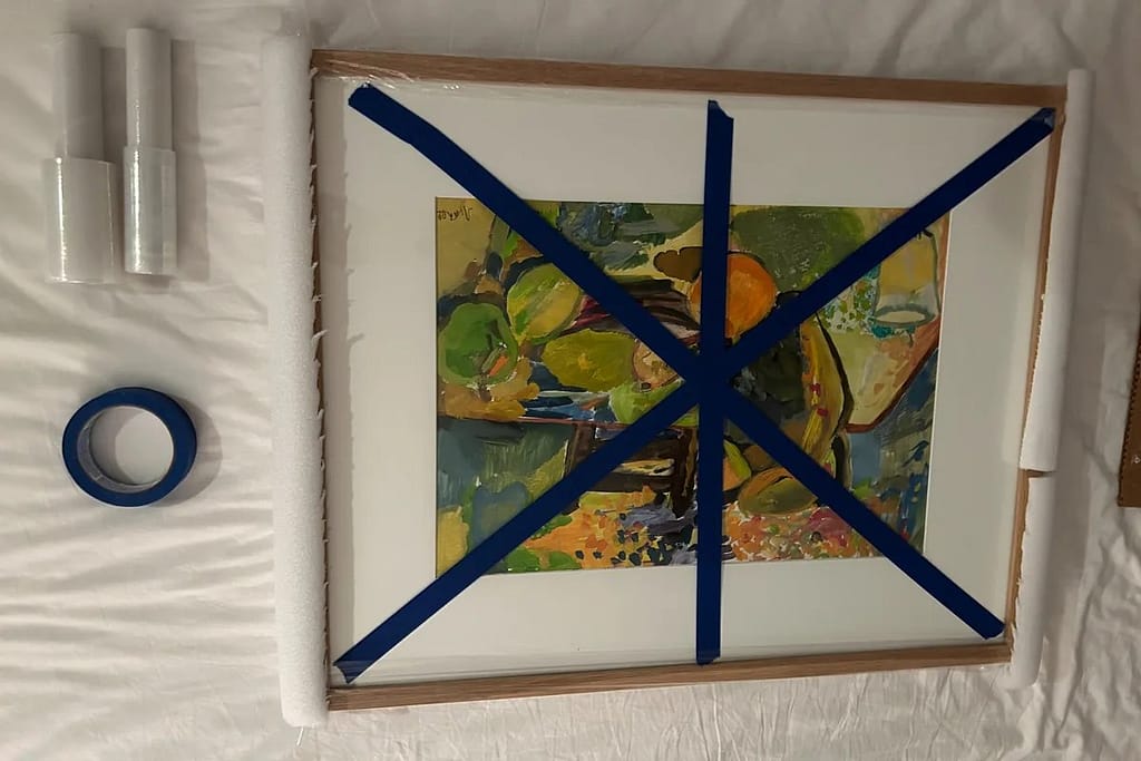 How to pack framed art for a move using painter's tape