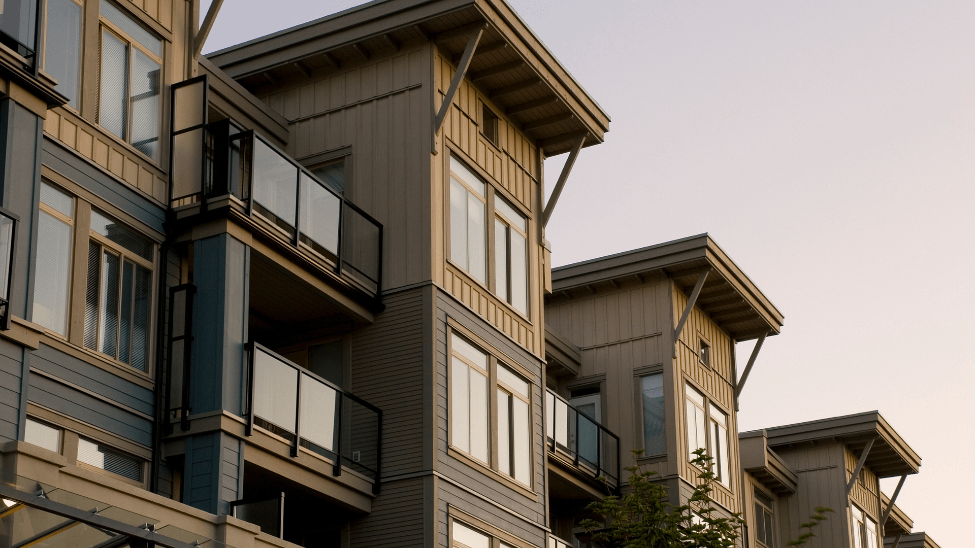 Modern condo building with balconies representing contemporary condo living